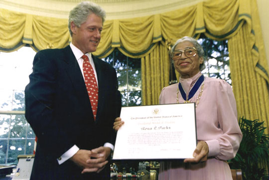 Rosa Parks with former President Bill Clinton in 1996 accepting the President Medal of Freedom.