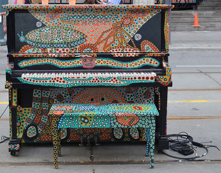 Piano that was on King Street West decorated with paint by artist  (Photo courtesy Now Toronto)
