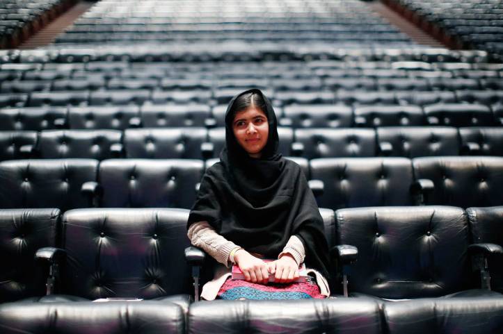 Pakistani teenage activist Yousafzai poses for pictures before an event launching her memoir "I Am Malala" in London